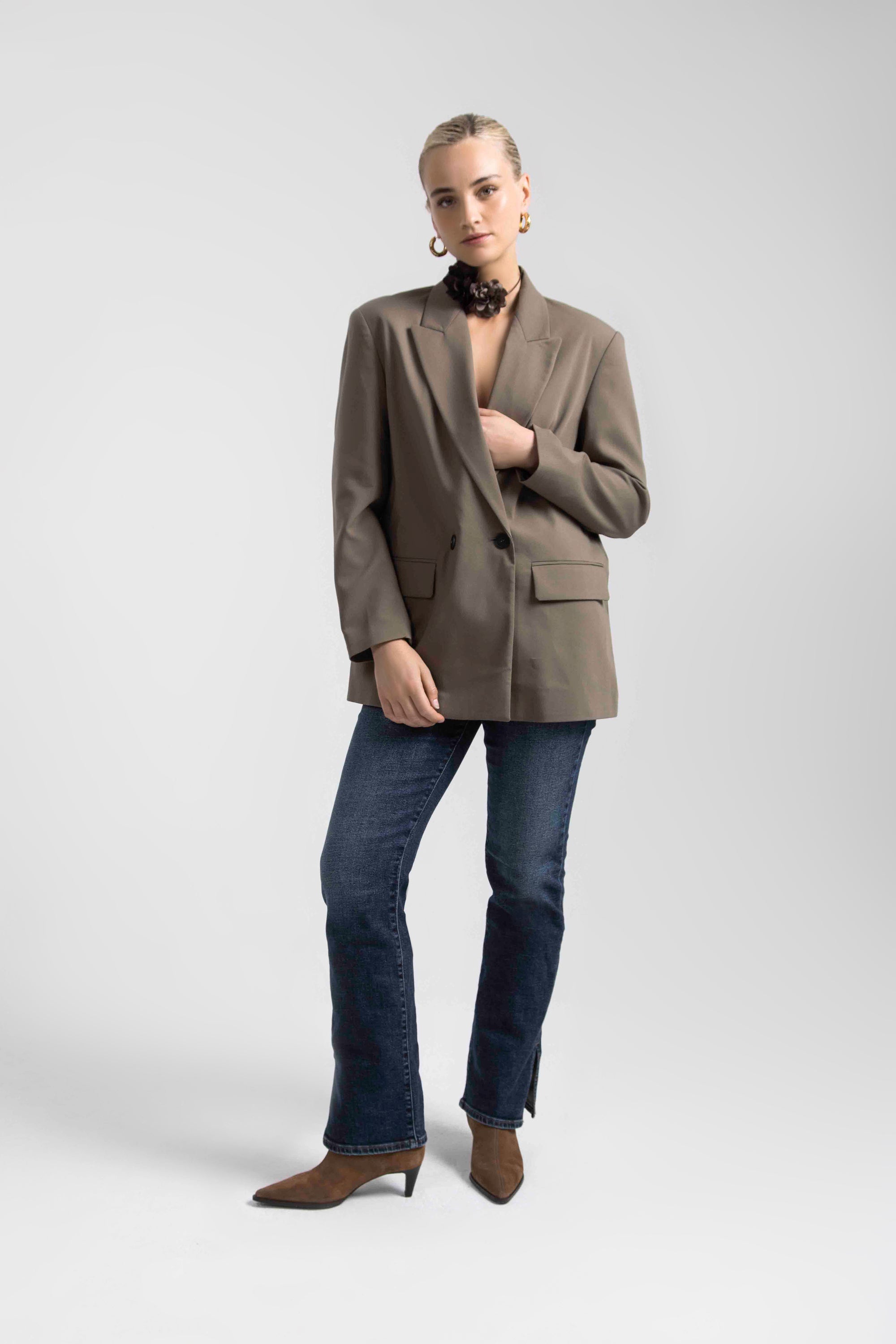 Smiling woman in jeans